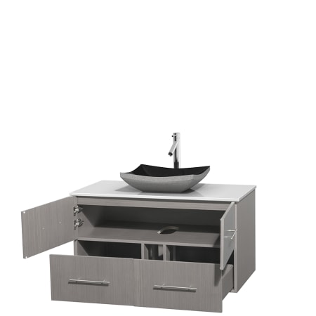 Open Vanity View with White Stone Top and Vessel Sink