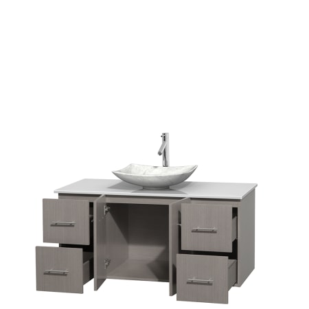 Open Vanity View with White Stone Top and Vessel Sink