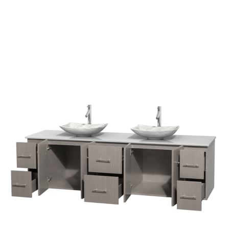 Open Vanity View with White Stone Top and Vessel Sinks