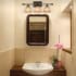 3 Light Bathroom Fixture Golden Bronze Finish Installed View