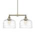 Innovations Lighting Bell 2 Light 21" Wide Linear Pendant Antique Brass / Clear Deco Swirl