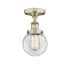 Innovations Lighting Beacon 6" Wide Semi-Flush Globe Ceiling Fixture Antique Brass / Clear