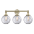 Innovations Lighting Beacon 3 Light 25" Wide Vanity Light Antique Brass / Clear