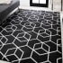 JONATHAN Y Lighting Supersoft 4' x 6' Polypropylene Geometric and Solid Indoor Area Rug Black / White