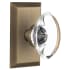 Nostalgic Warehouse Oval Clear Crystal Solid Brass Passage Door Knob Set with Studio Rose and 2-3/4" Backset Antique Brass
