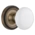 Nostalgic Warehouse White Porcelain Solid Brass Privacy Door Knob Set with Rope Rose and 2-3/4" Backset Antique Brass