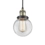 Innovations Lighting Beacon Single Light 6" Wide Mini Pendant with Adjustable Cord Black Antique Brass / Clear
