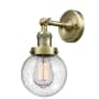 Innovations Lighting Beacon 12" Tall Bathroom Sconce Antique Brass / Seedy