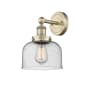 Innovations Lighting Bell 10" Tall Wall Sconce Antique Brass / Seedy