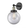 Innovations Lighting Beacon 10" Tall Wall Sconce Black Antique Brass / Clear