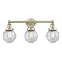 Innovations Lighting Beacon 3 Light 25" Wide Vanity Light Antique Brass / Seedy / Multi-Colored