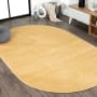 JONATHAN Y Lighting Supersoft 5' x 8' Polypropylene Solid Indoor Oval Area Rug Mustard