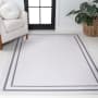 JONATHAN Y Lighting Washable 8-3/4' x 12' Chenille Border, Solid, Traditional, and Transitional Indoor Rectangular Area Rug White / Gray