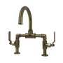 Kingston Brass Whitaker 1.2 GPM Deck Mounted Bridge Bathroom Faucet with Pop-Up Drain Assembly Antique Brass