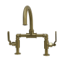 Kingston Brass Whitaker 1.2 GPM Deck Mounted Bridge Bathroom Faucet with Pop-Up Drain Assembly Brushed Brass