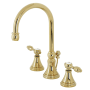 Kingston Brass Tudor 1.2 GPM Deck Mounted Widespread Bathroom Faucet with Pop-Up Drain Assembly Polished Brass
