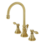 Kingston Brass Tudor 1.2 GPM Deck Mounted Widespread Bathroom Faucet with Pop-Up Drain Assembly Brushed Brass