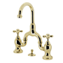 Kingston Brass English Country 1.2 GPM Bridge Bathroom Faucet with Pop-Up Drain Assembly Polished Brass