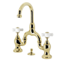 Kingston Brass English Country 1.2 GPM Bridge Bathroom Faucet with Pop-Up Drain Assembly Polished Brass