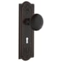 Nostalgic Warehouse Black Porcelain Solid Brass Passage Door Knob Set with Meadows Rose, Keyhole and 2-3/8" Backset Timeless Bronze