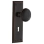 Nostalgic Warehouse Black Porcelain Solid Brass Passage Door Knob Set with New York Rose, Keyhole and 2-3/8" Backset Timeless Bronze