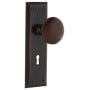 Nostalgic Warehouse Brown Porcelain Solid Brass Single Dummy Door Knob with New York Rose and Keyhole Timeless Bronze