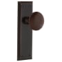 Nostalgic Warehouse Brown Porcelain Solid Brass Privacy Door Knob Set with New York Rose and 2-3/8" Backset Timeless Bronze