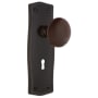 Nostalgic Warehouse Brown Porcelain Solid Brass Passage Door Knob Set with Prairie Rose, Keyhole and 2-3/8" Backset Timeless Bronze