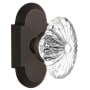 Nostalgic Warehouse Vintage Farmhouse Oval Fluted Crystal Flower Passage Door Knob Set with Solid Brass Cottage Style Plate and 2-3/4" Backset Oil-Rubbed Bronze