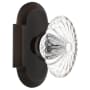 Nostalgic Warehouse Vintage Farmhouse Oval Fluted Crystal Flower Passage Door Knob Set with Solid Brass Cottage Style Plate and 2-3/4" Backset Timeless Bronze