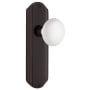 Nostalgic Warehouse Vintage White Porcelain Passage Door Knob Set with Brass Art Deco Plate and 2-3/4" Backset Timeless Bronze