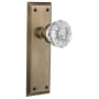 Nostalgic Warehouse Crystal Solid Brass Passage Door Knob Set with New York Rose and 2-3/4" Backset Antique Brass