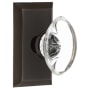 Nostalgic Warehouse Oval Clear Crystal Solid Brass Passage Door Knob Set with Studio Rose and 2-3/4" Backset Timeless Bronze