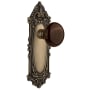 Nostalgic Warehouse Brown Porcelain Solid Brass Privacy Door Knob Set with Victorian Rose and 2-3/8" Backset Antique Brass