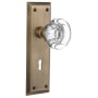 Nostalgic Warehouse Round Clear Crystal Solid Brass Privacy Door Knob Set with New York Rose, Keyhole and 2-3/8" Backset Antique Brass