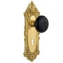 Nostalgic Warehouse Black Porcelain Solid Brass Passage Door Knob Set with Victorian Rose, Keyhole and 2-3/8" Backset Unlacquered Brass