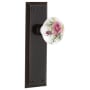 Nostalgic Warehouse Rose Porcelain Solid Brass Privacy Door Knob Set with New York Rose and 2-3/4" Backset Timeless Bronze