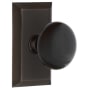 Nostalgic Warehouse Black Porcelain Solid Brass Privacy Door Knob Set with Studio Rose and 2-3/4" Backset Timeless Bronze