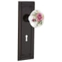 Nostalgic Warehouse Rose Porcelain Solid Brass Privacy Door Knob Set with Mission Rose, Keyhole and 2-3/4" Backset Timeless Bronze