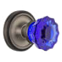 Nostalgic Warehouse Classic Solid Brass Rose Passage Door Knob Set with Cobalt Crystal Knob and 2-3/8" Backset Antique Pewter