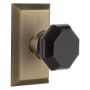 Nostalgic Warehouse Studio Solid Brass Rose Passage Door Knob Set with Black Waldorf Knob and 2-3/8" Backset Antique Brass