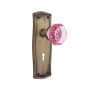 Nostalgic Warehouse Prairie Solid Brass Rose Passage Door Knob Set with Pink Waldorf Knob and Decorative Keyhole for 2-3/8" Backset Antique Brass