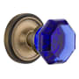 Nostalgic Warehouse Classic Solid Brass Rose Privacy Door Knob Set with Cobalt Waldorf Knob and 2-3/8" Backset Antique Brass