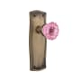 Nostalgic Warehouse Prairie Solid Brass Rose Privacy Door Knob Set with Pink Crystal Knob for 2-3/4" Backset Antique Brass