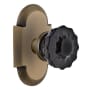 Nostalgic Warehouse Cottage Solid Brass Rose Passage Door Knob Set with Black Crystal Knob and 2-3/8" Backset Antique Brass