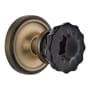 Nostalgic Warehouse Classic Solid Brass Rose Privacy Door Knob Set with Black Crystal Knob and 2-3/8" Backset Antique Brass