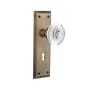 Nostalgic Warehouse Vintage Crystal Egg and Dart Passage Door Knob Set with New York Rose, 2-3/8" Backset and Decorative Keyhole Antique Brass