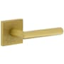 Viaggio Motivo Right Handed Solid Brass Passage Door Lever Set with Moderno Lever and Quadrato Leather Backplate - 2-3/8" Backset Satin Brass