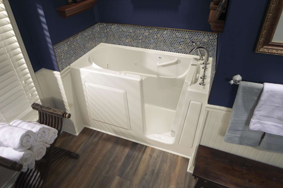 American Standard walk-in tub installed in a navy bathroom