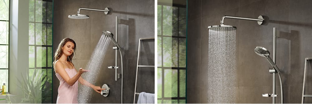 Woman feeling water spray with her hand. Close up of Raindance shower head.